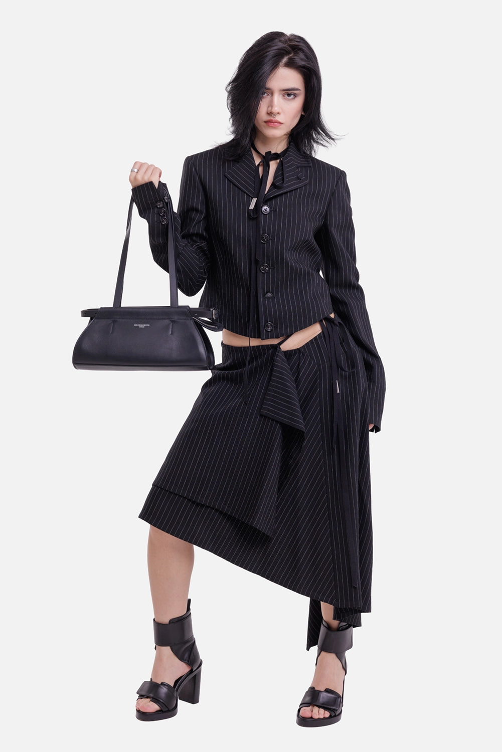 Ann Demeulemeester women's cropped blazer in black and grey, model view with chalk stripes and ribbon ties