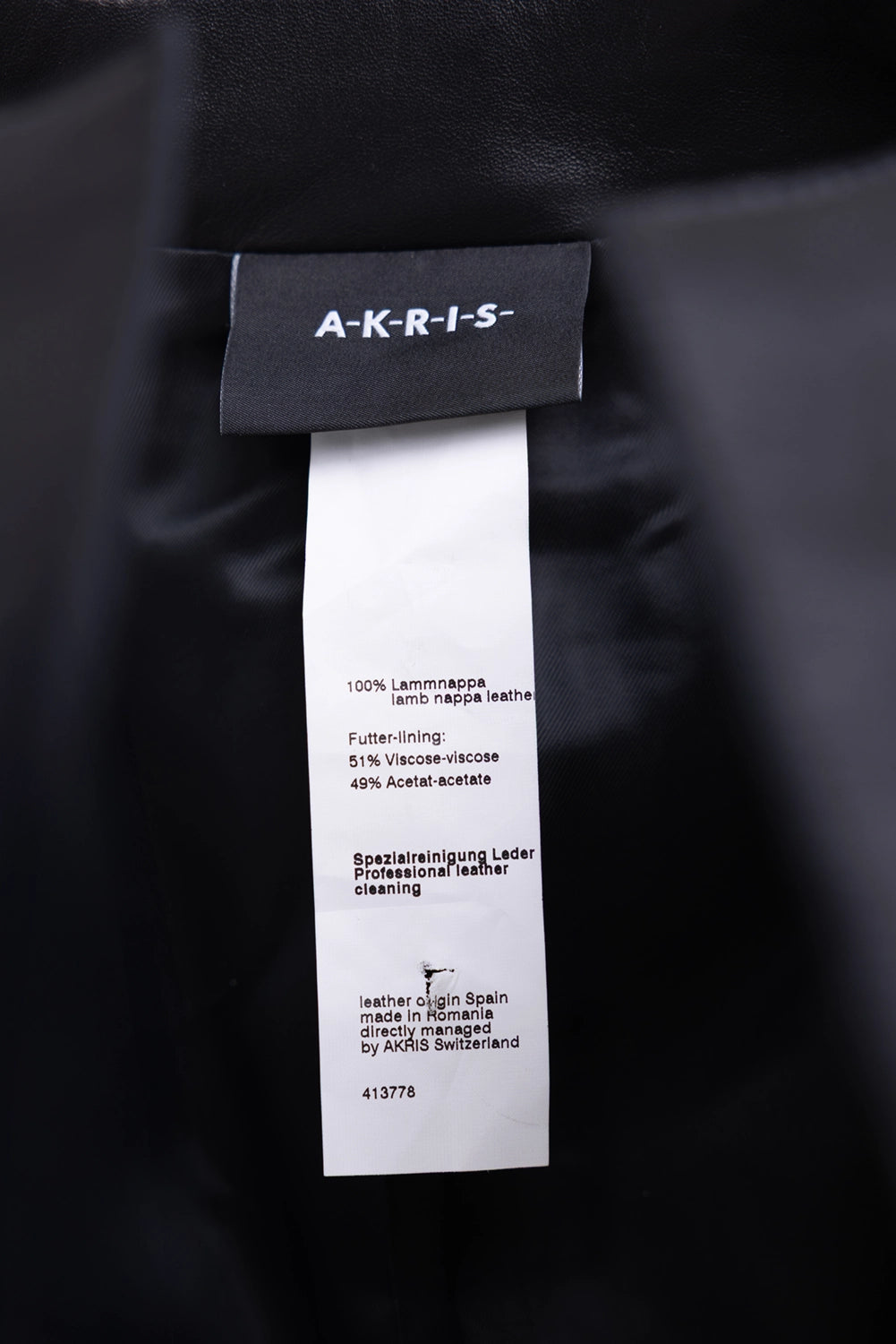 Pre-owned Akris cropped leather jacket in black, care label close-up, lamb nappa leather and viscose-acetate lining text