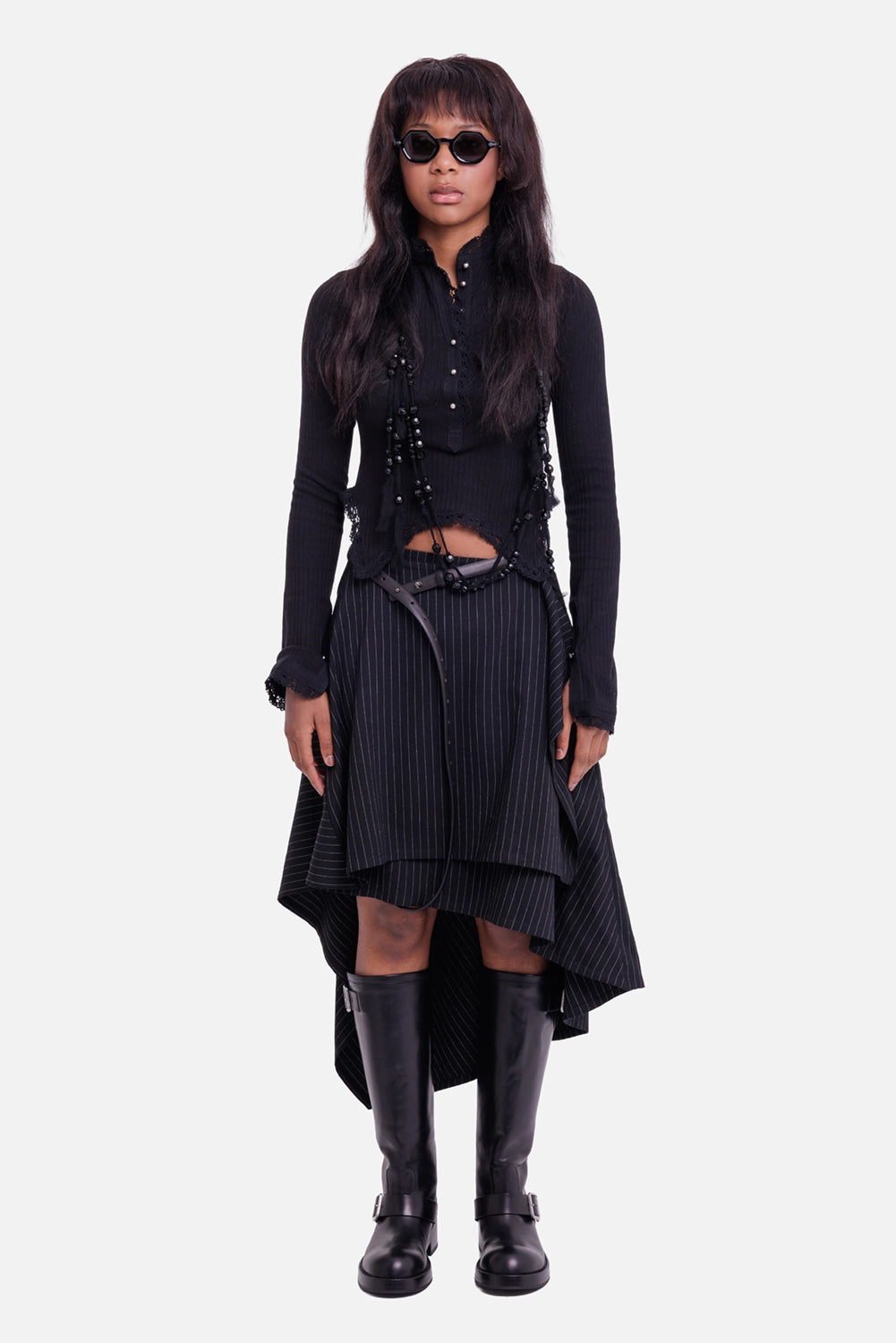 Ann Demeulemeester women's cropped top in black, full-length model view with asymmetric lace hem and long sleeves