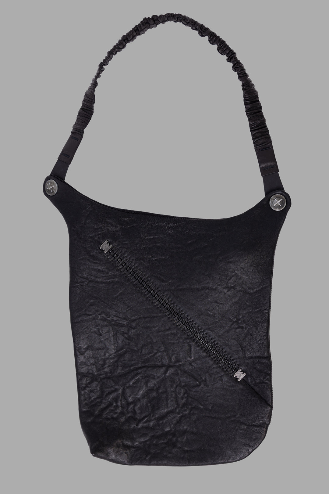 Isaac Sellam Experience unisex black leather crossbody bag, front view with diagonal metal spine zip.
