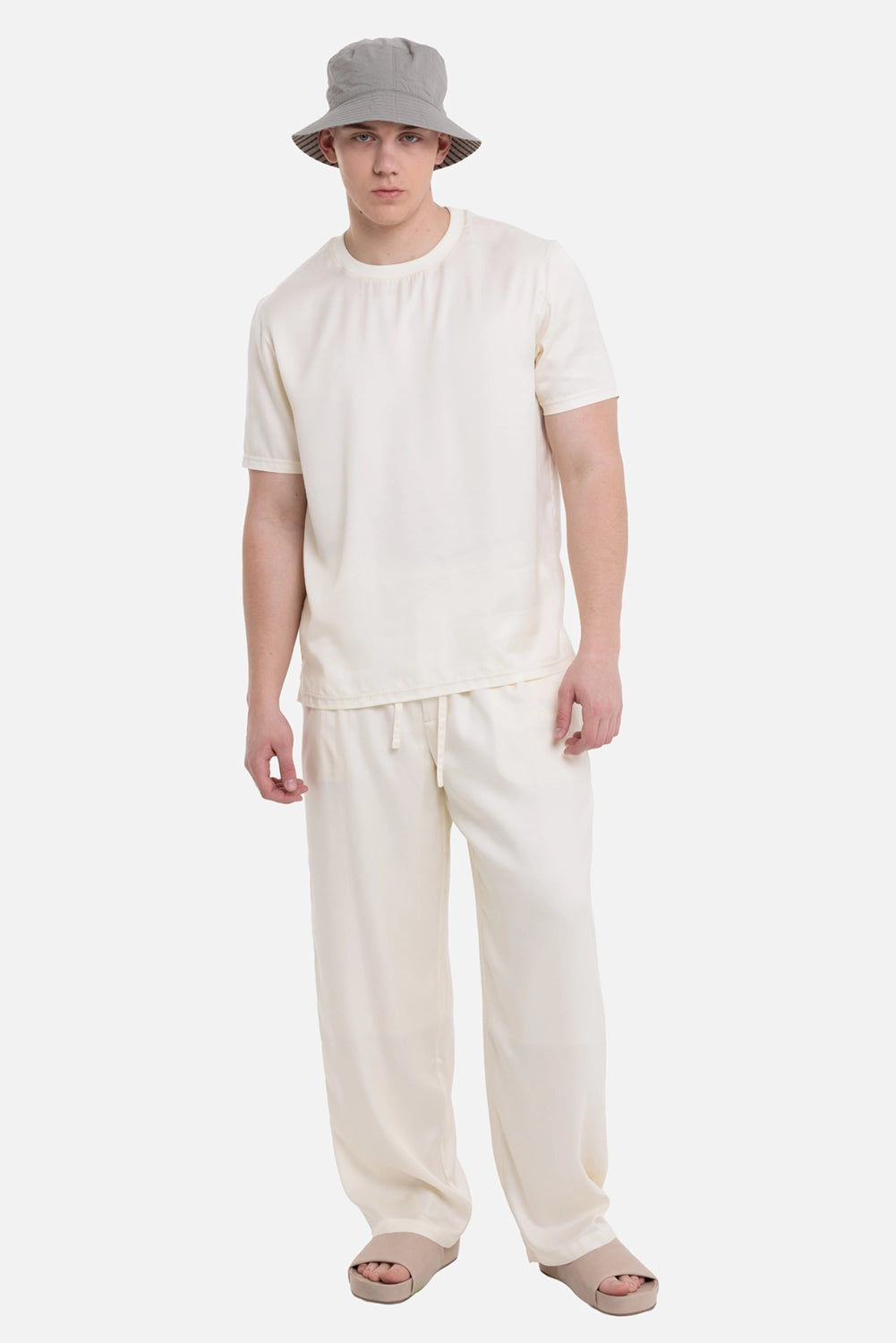 ATTACHMENT men's T-shirt in off-white, on-model full-length view with relaxed drape and crew neck