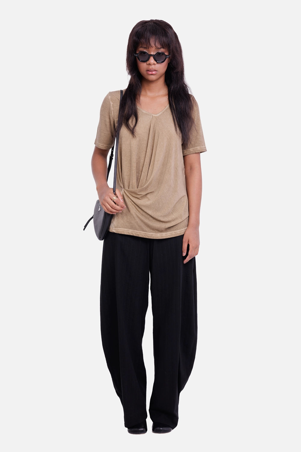 Uma Wang women's black trousers, full-length model view with long curved legs and relaxed tailored silhouette