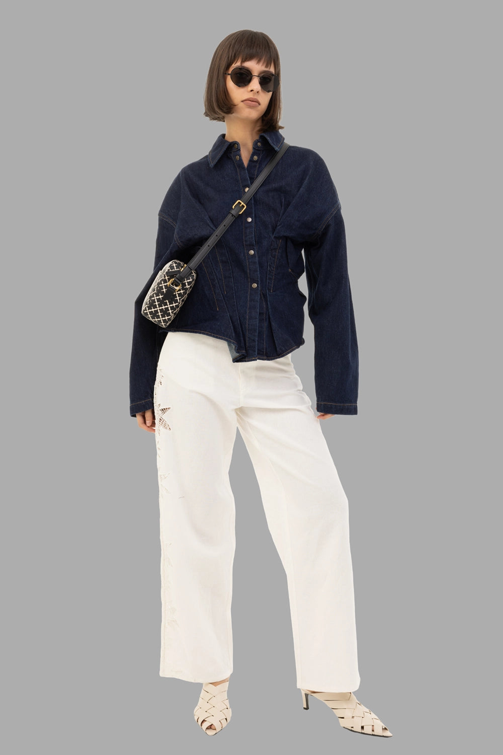 A.W.A.K.E. MODE women's denim shirt in indigo rinse wash, on-model full length, sculpted waist pleats
