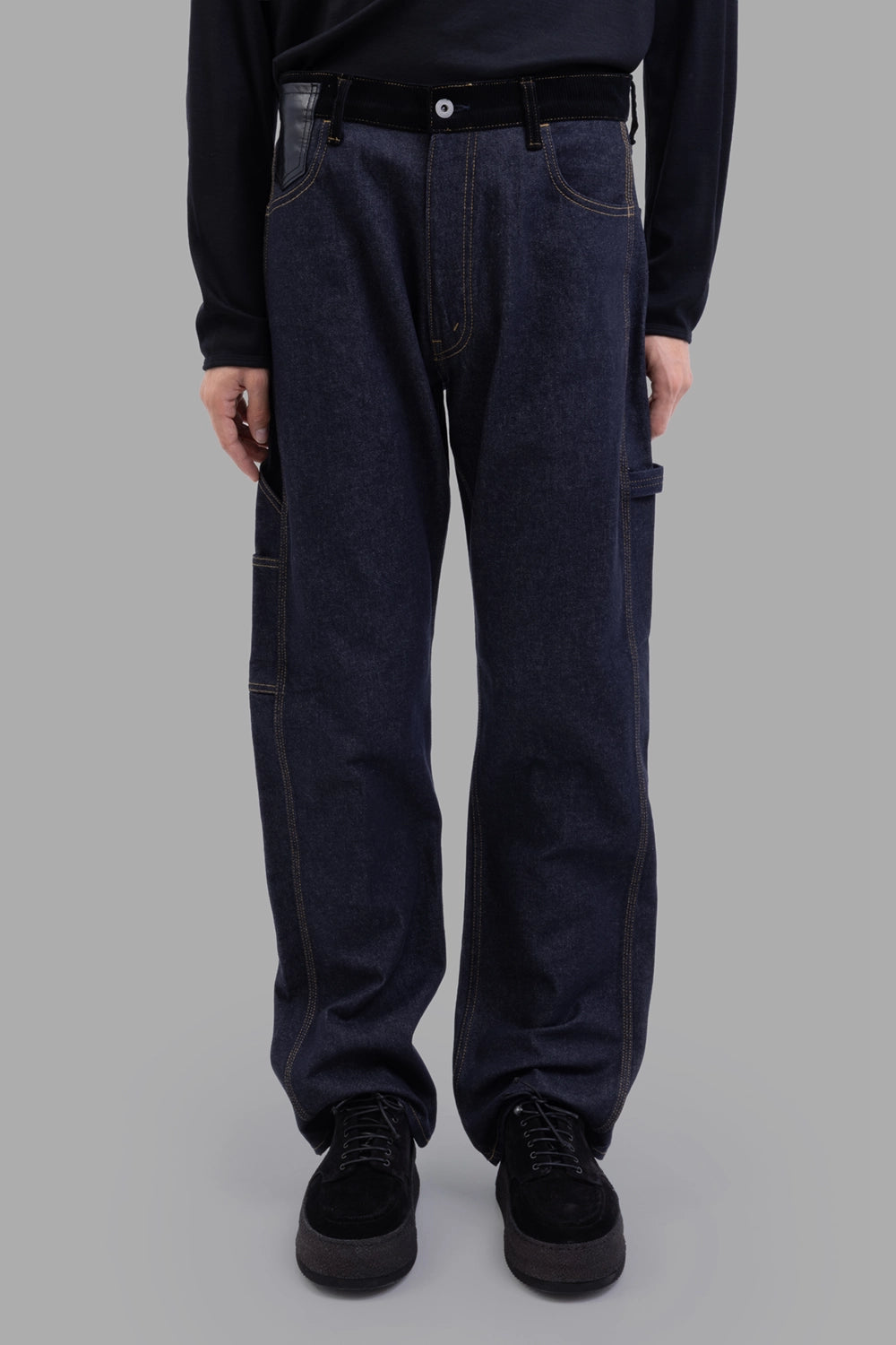 Junya Watanabe denim trousers in indigo, front view, top button & pockets