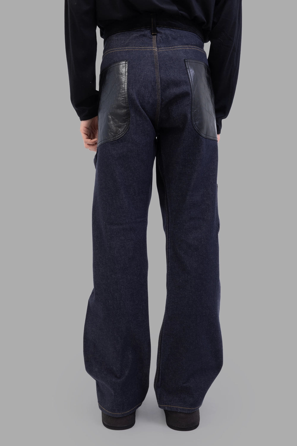 Junya Watanabe denim trousers in indigo, side view, contrast stitching