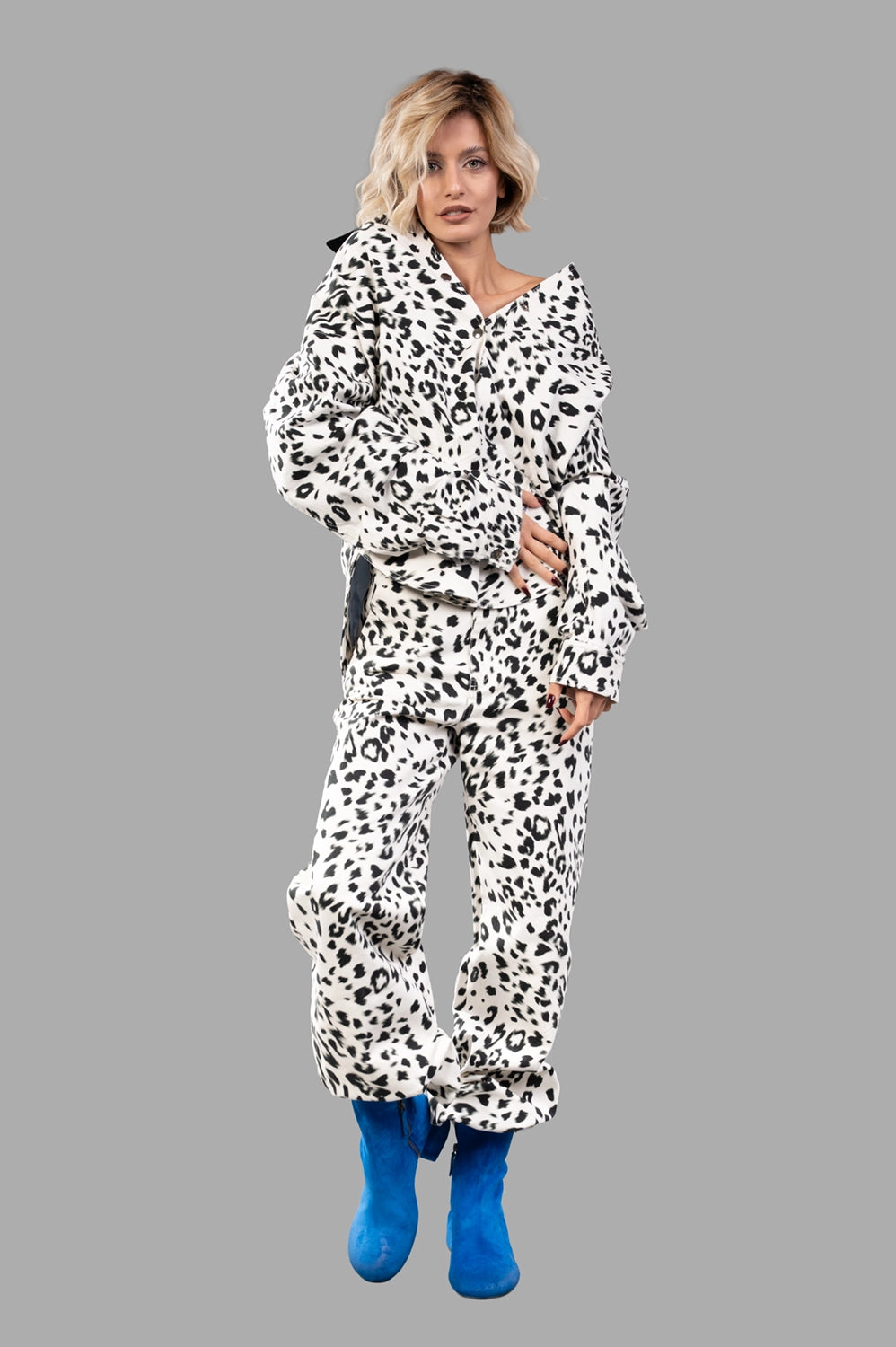 Full-length view of leopard-print workwear shirt in creme and black with contrast collar, oversized fit