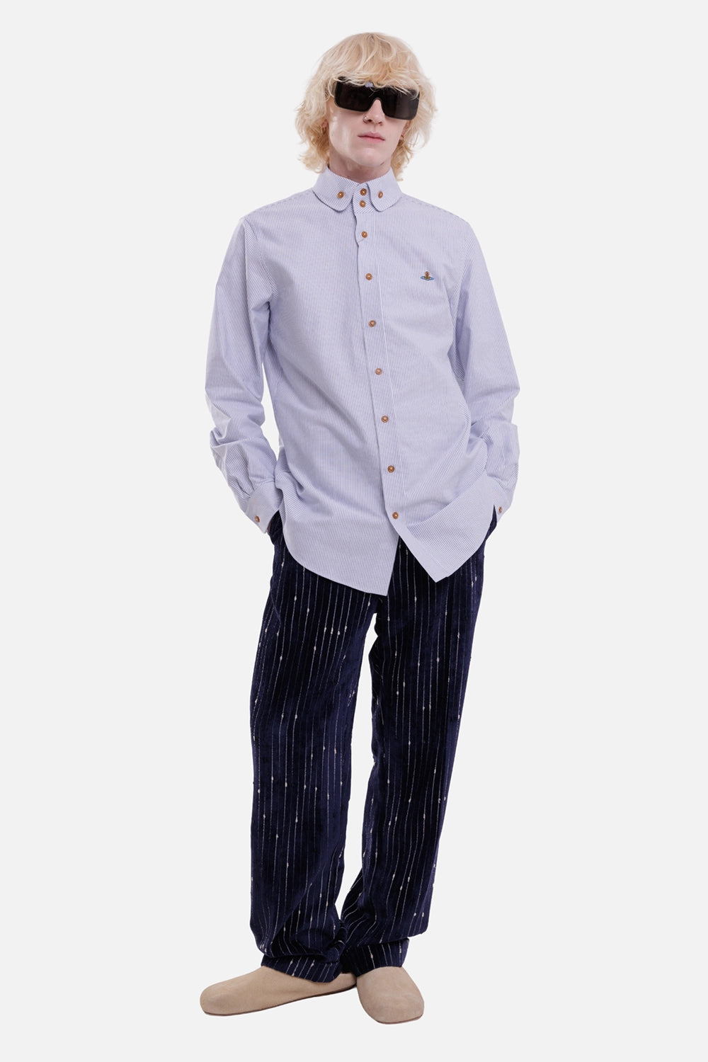 Vivienne Westwood men's trousers in navy and white, full-length on-model view with distressed stripes and rolled cuffs