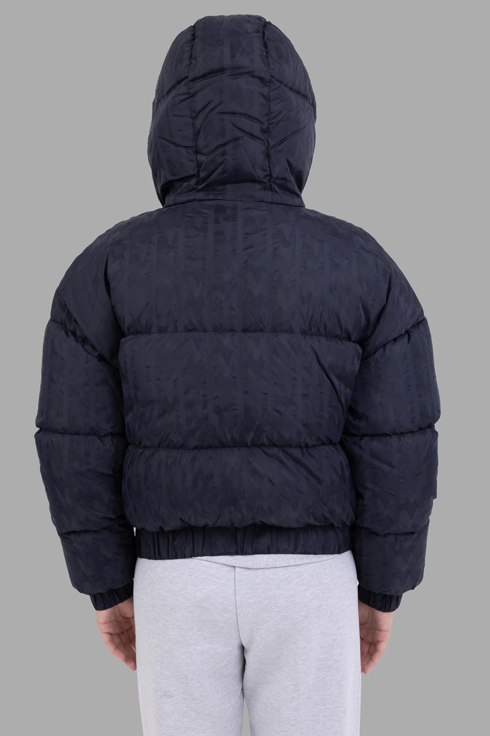 MSGM women down jacket in black, back view, horizontal quilting and elastic hem