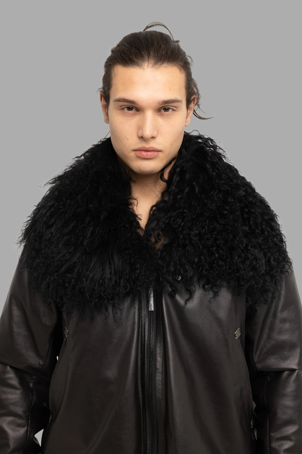 Isaac Sellam Experience unisex down jacket in black, collar detail, curly Mongolian shearling and two-way zip puller