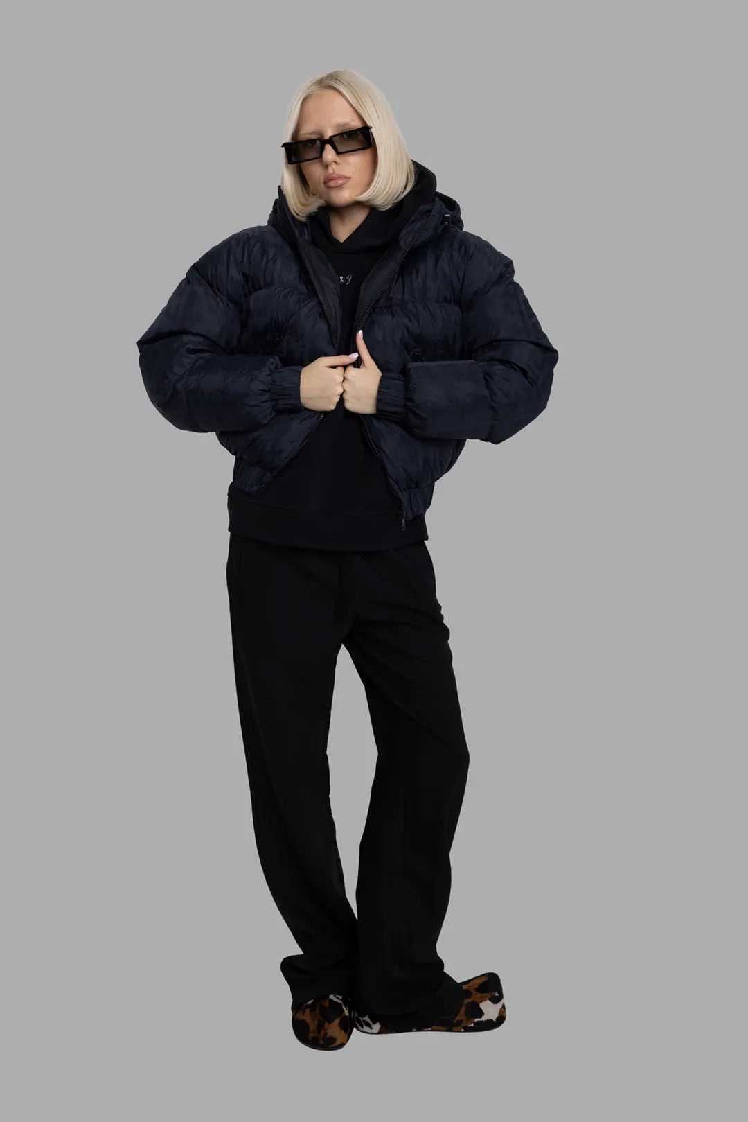 MSGM women's black logo-jacquard hooded down jacket, full-length front view on model, oversized padded silhouette.