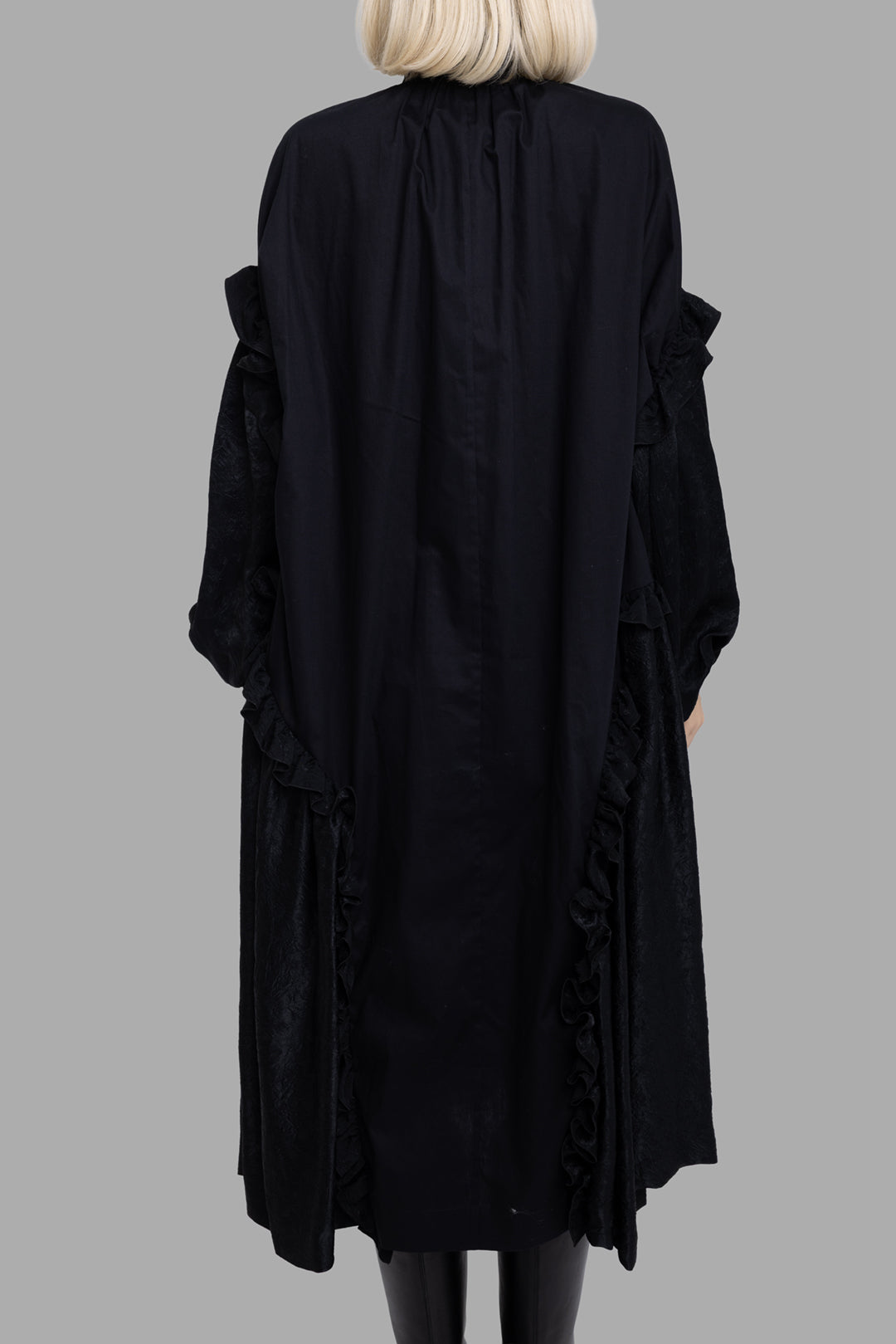 Noir Kei Ninomiya women's black cotton dress, back view, draped attached panels with ruffled edges and relaxed fit