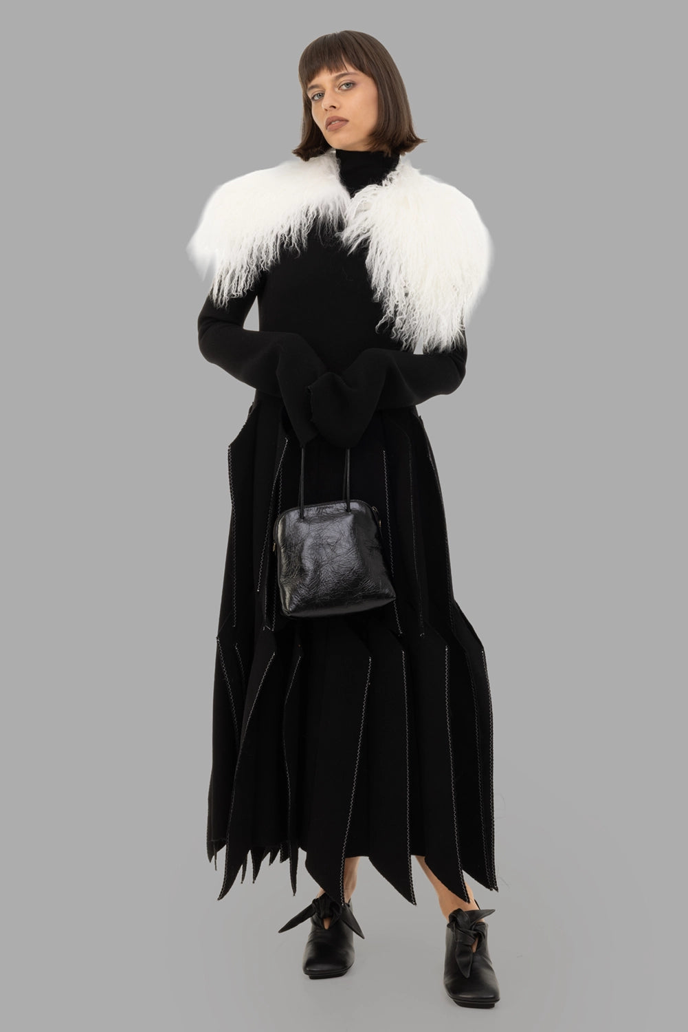 A.W.A.K.E. MODE women black wool-crepe dress, on-model full length, turtleneck and 3D panelled skirt.