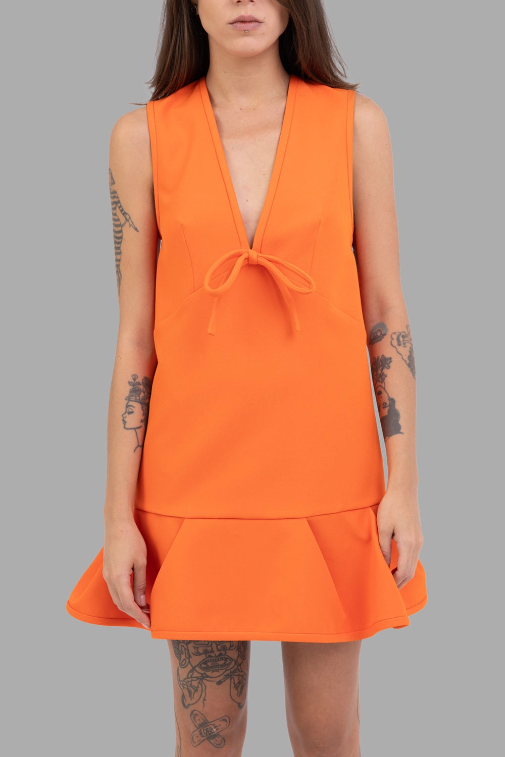 MSGM women dress in orange, front view, plunge V-neck with self-tie bow, panelled flounce hem