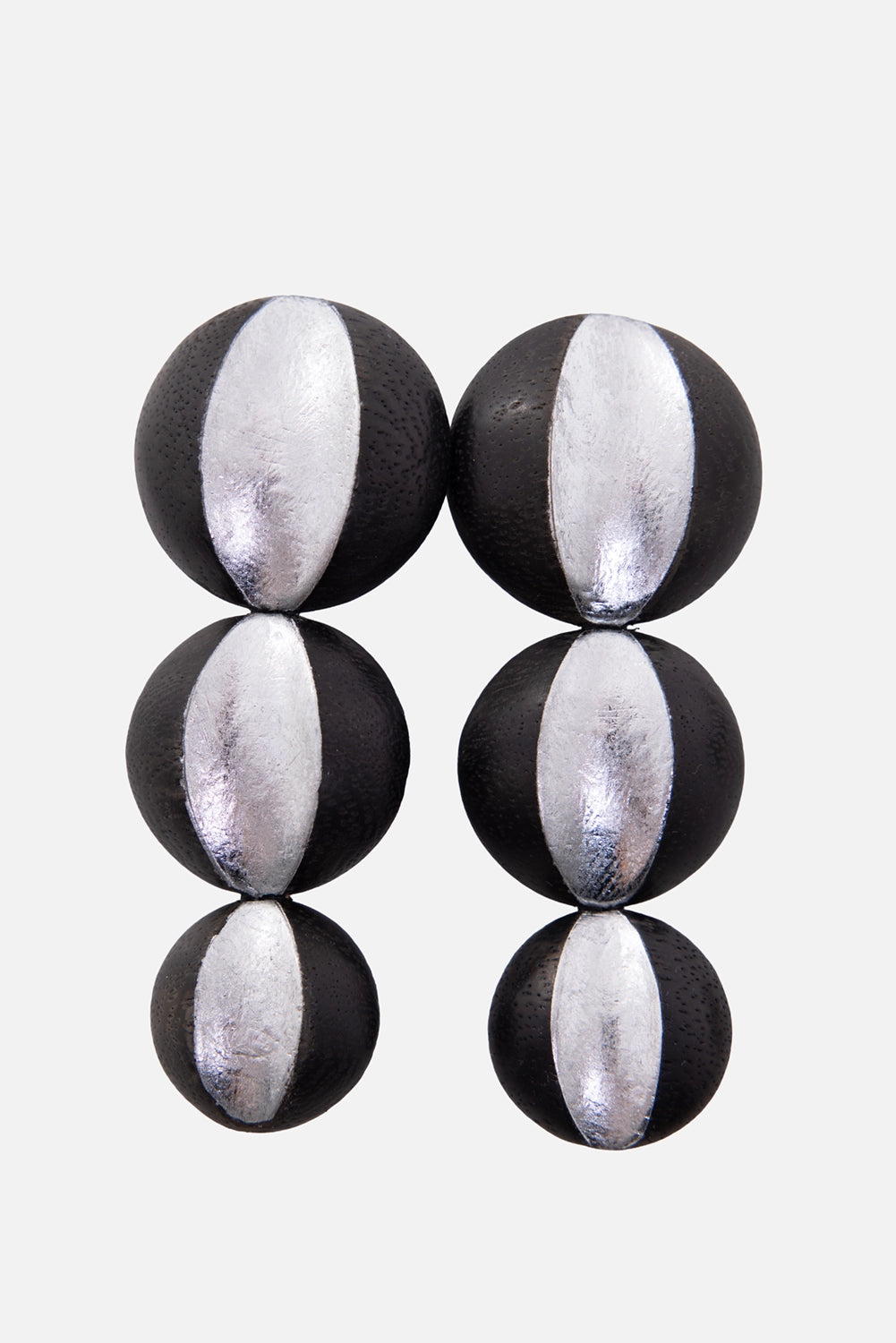 Monies women's earrings in black/silver, front view, circular wood drops with silver foil panels