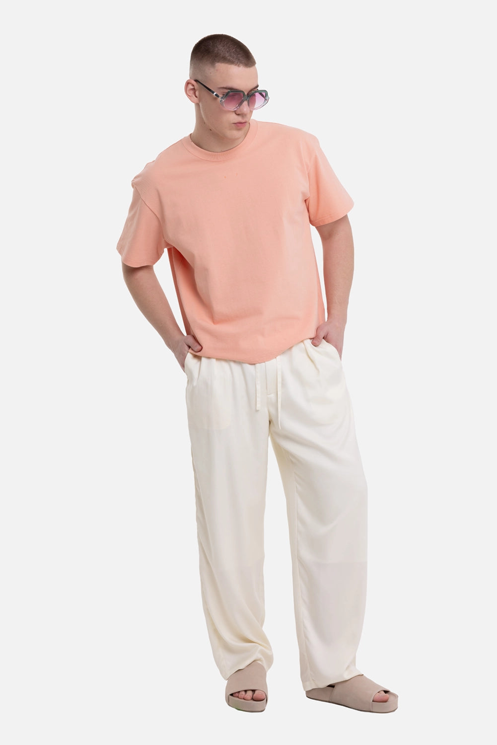 ATTACHMENT men's easy trousers in off white, on-model full-length view, relaxed drape and drawstring waist