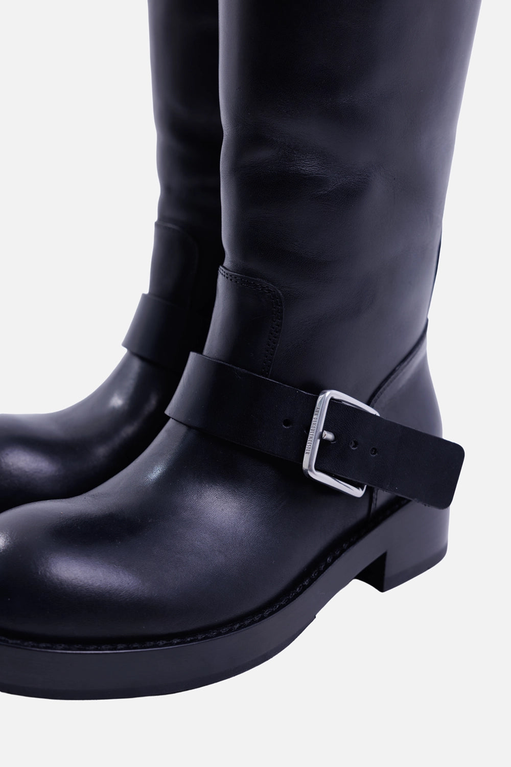 Ann Demeulemeester women's Arwa boots in black, hardware close-up with engraved silver buckle and smooth leather