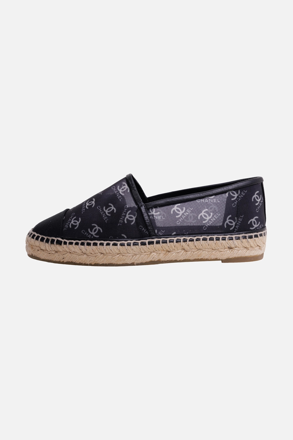 Chanel women's espadrilles in black, side view, CC logo canvas and woven jute midsole