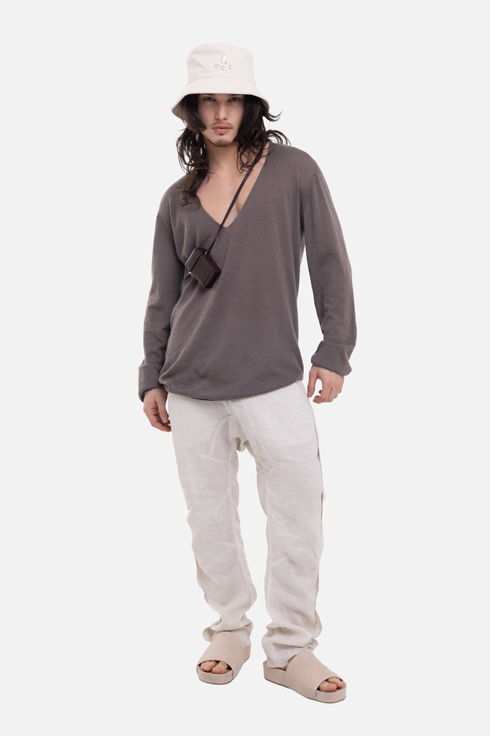 Rick Owens men's V-neck sweater in dust, on-model full-length view, relaxed fit and deep neckline