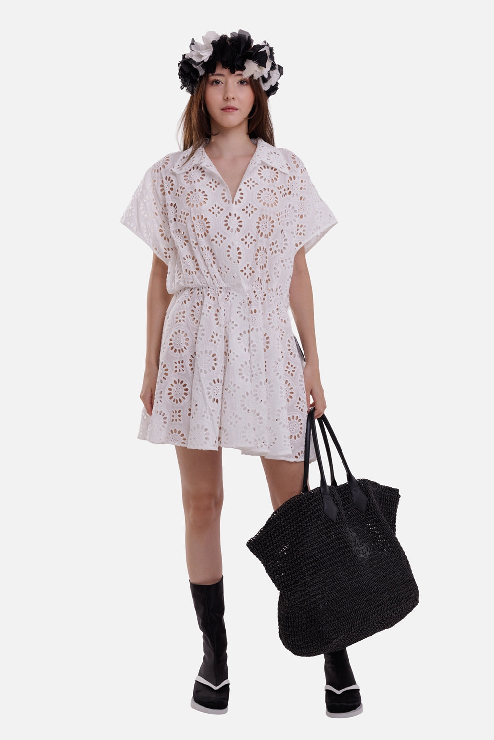 Norma Kamali women's white eyelet mini dress, on-model full-length view with shirt collar and flared skirt