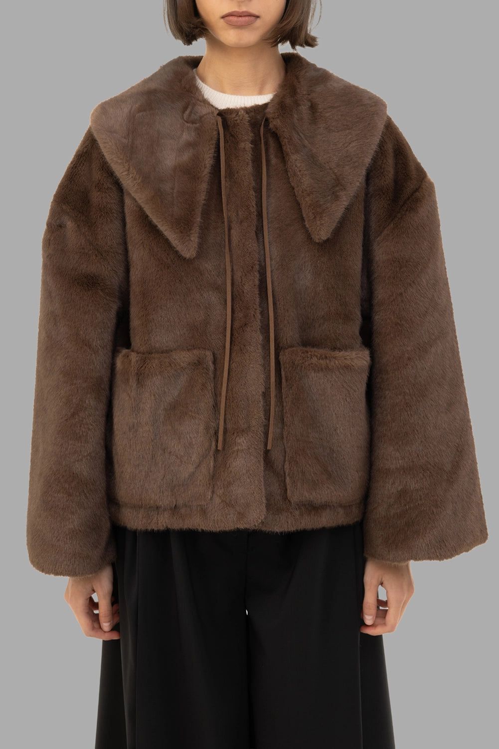 By Malene Birger women's faux-fur jacket in Carafe, front view, half length, pointed collar with ties and patch pockets