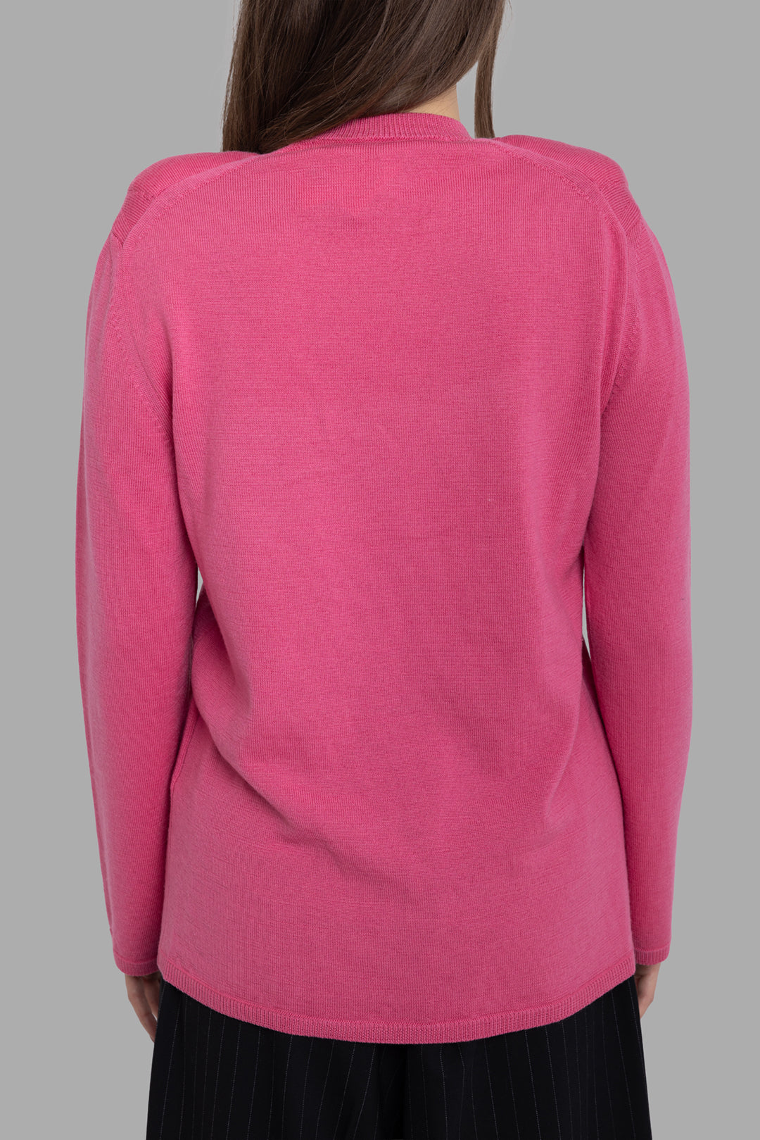 Comme des Garçons women's pink wool jumper, back view, clean fine-knit finish with relaxed straight hem.