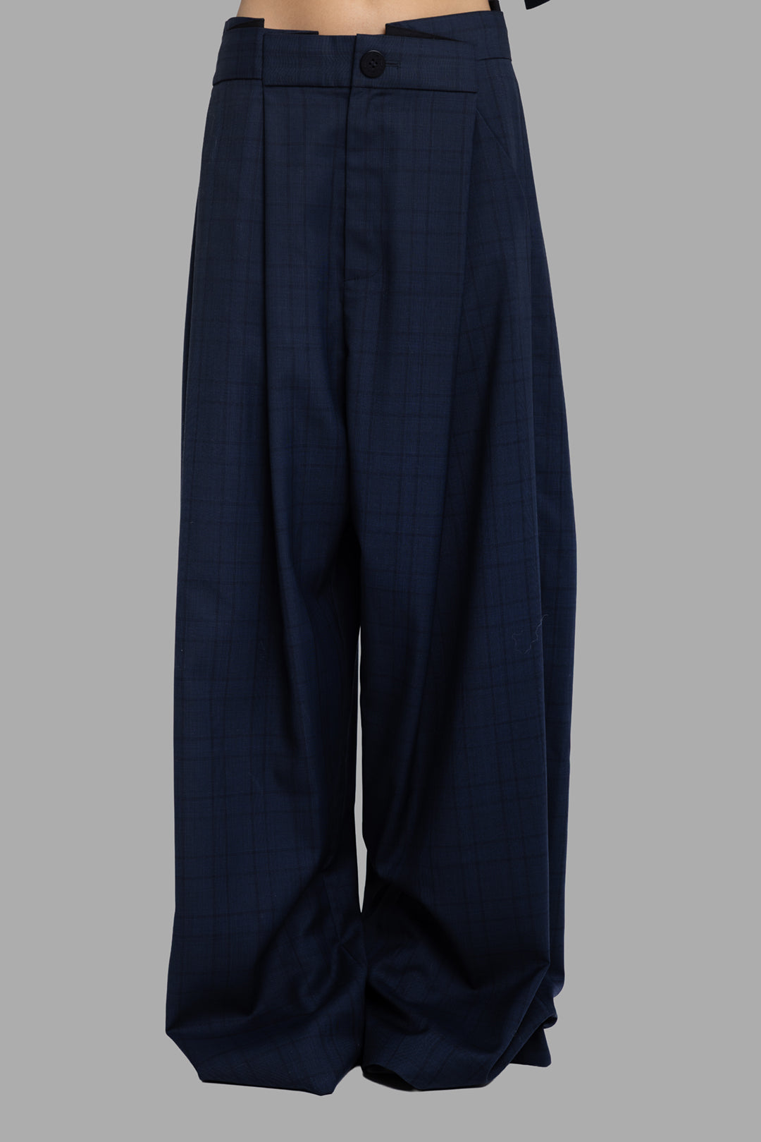 Natasha Zinko folded trousers in blue check, front view showing pleated high waist and folded pooling hem