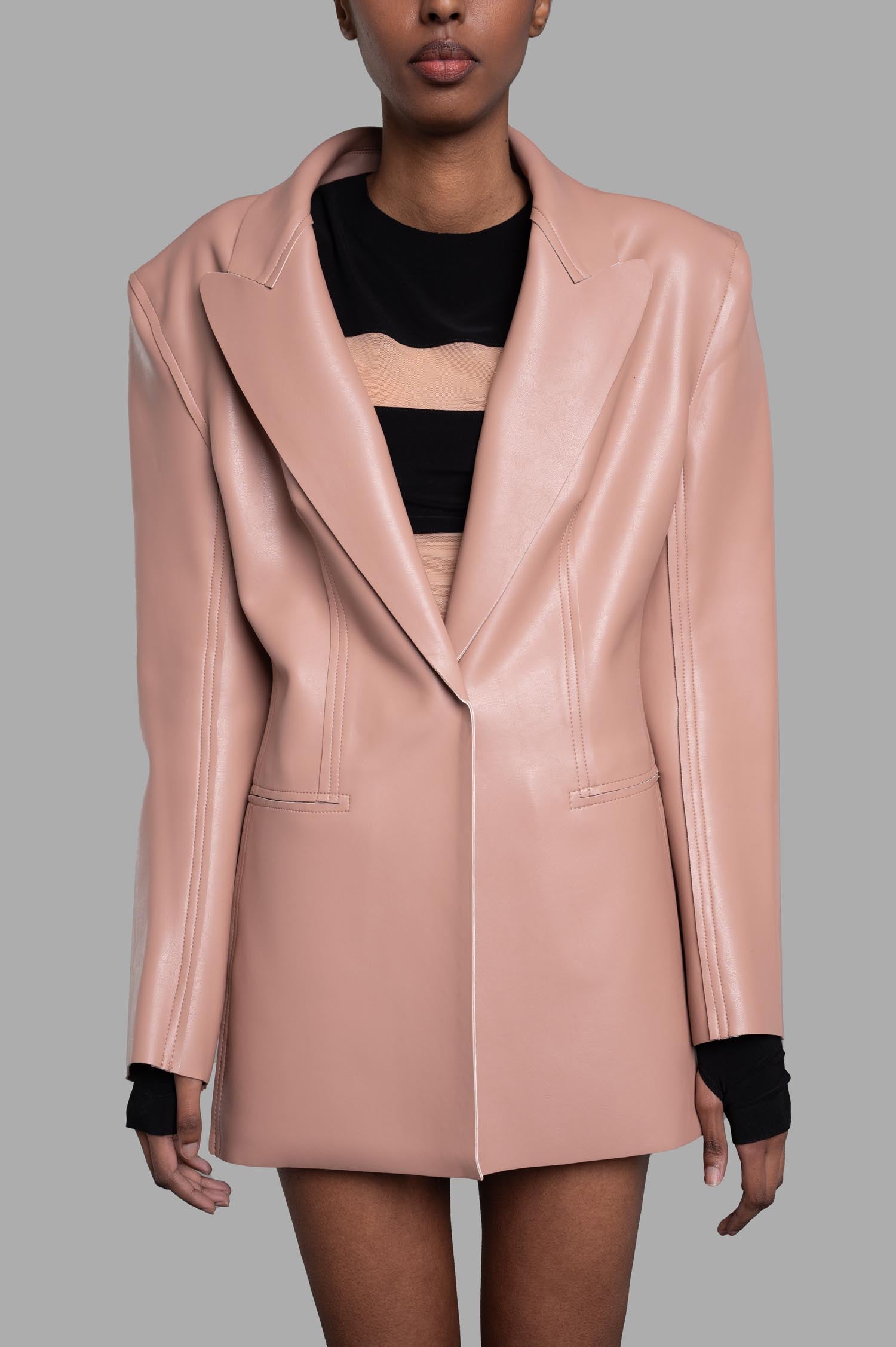 Norma Kamali Faux Leather Blazer in luxurious powder pink, showcasing front detail and sophisticated design.