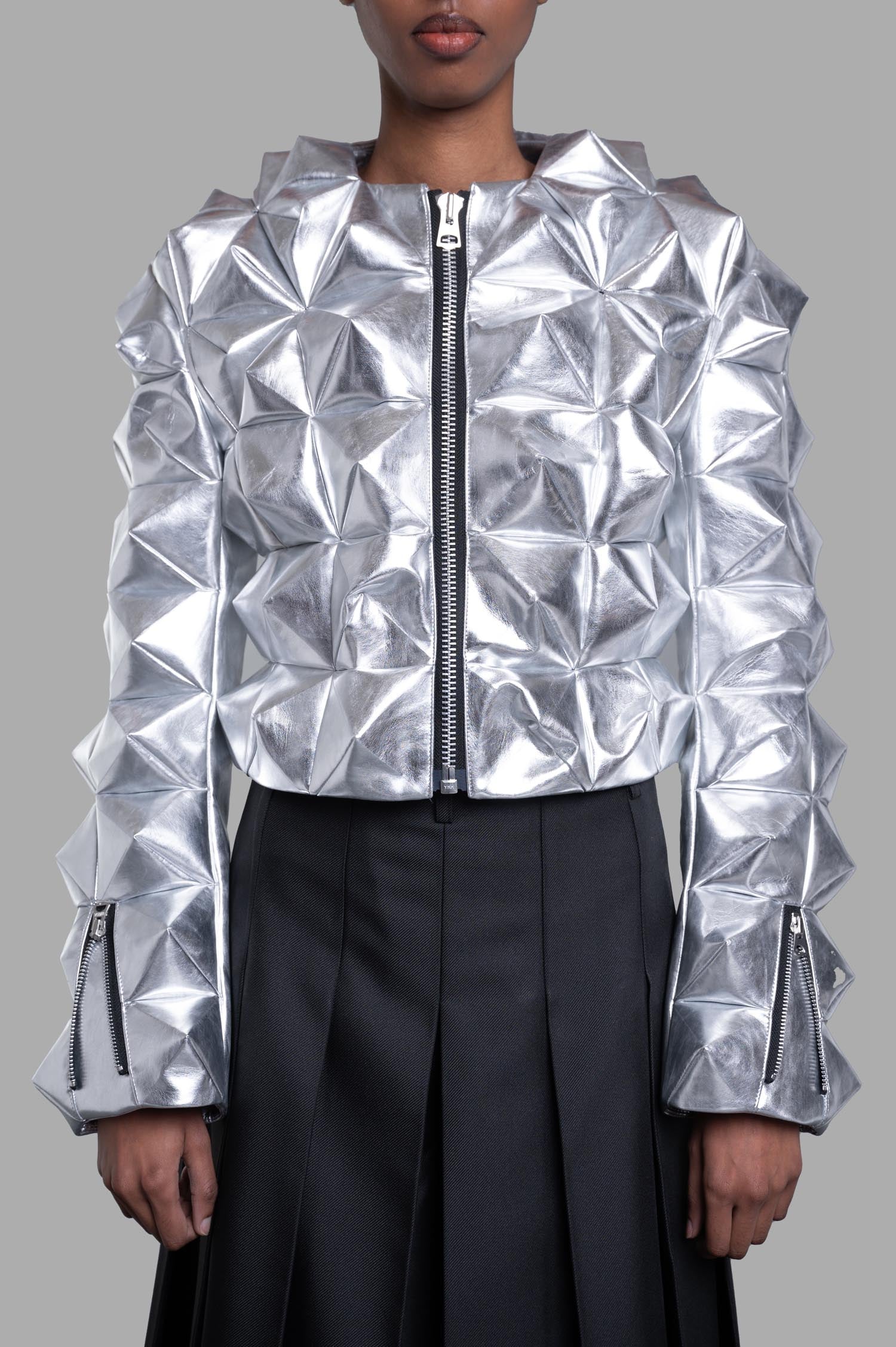 Junya Watanabe 3D-stud Jacket in Silver, front on-model view with geometric texture, zip front and cuff zips.