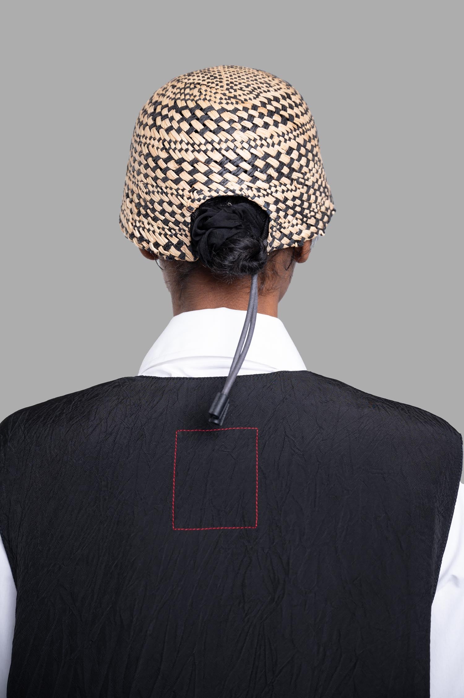 Kijima Takayuki Color-block Straw Hat viewed from the back, showcasing intricate weaving and a modern aesthetic.