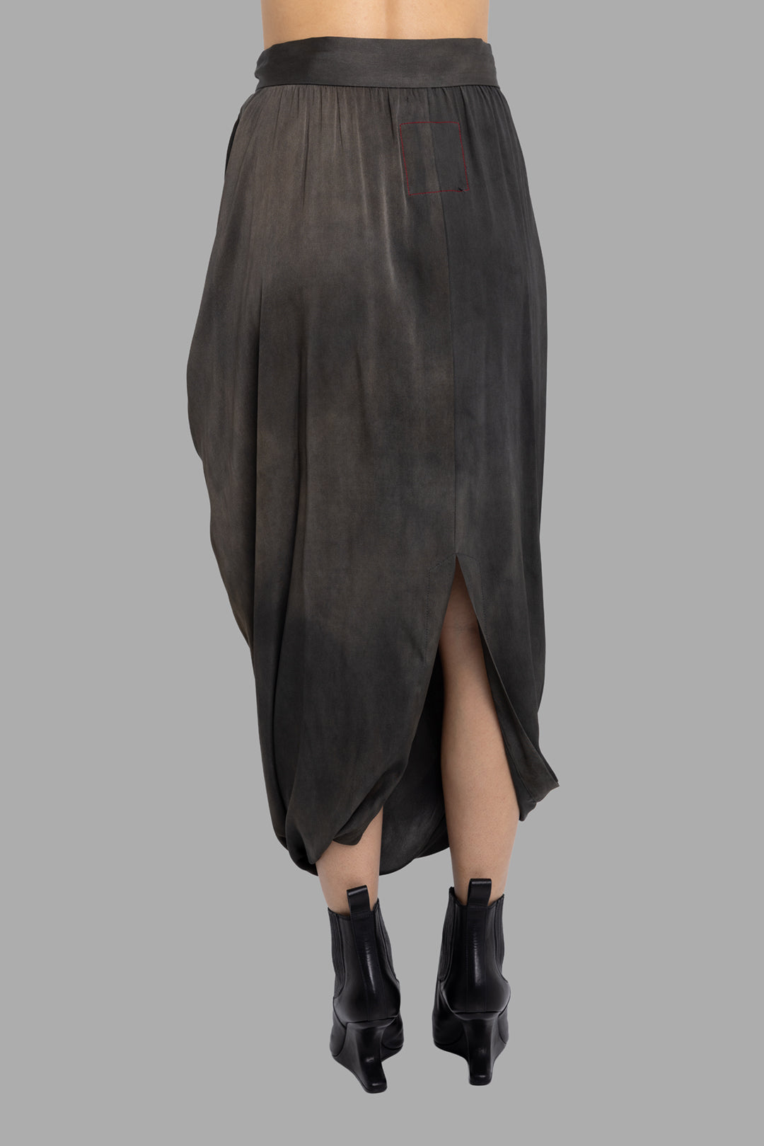 Uma Wang women's dark grey silk Gink draped midi skirt, back view with split hem and gathered drape.