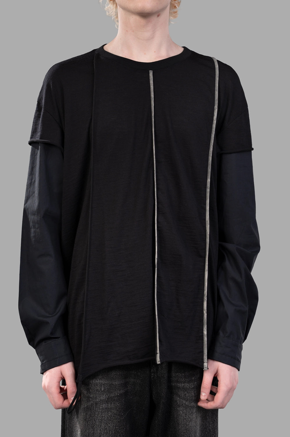 Front close-up showing crew neck, double-sleeve effect and off-center grosgrain line detail