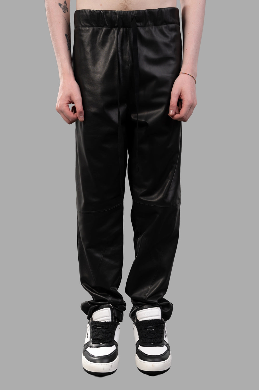 Front close-up of drawstring waist, smooth front panels and knee seam detail