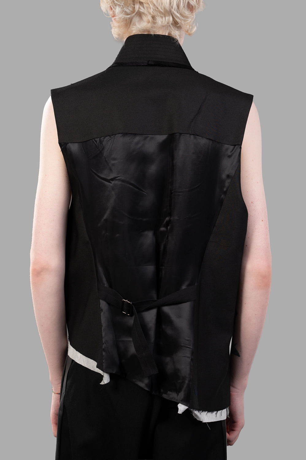 Back close-up showing satin panel with adjustable strap and open-back construction