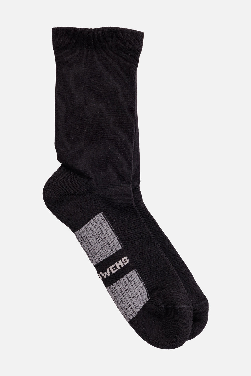 Rick Owens unisex glitter socks in black and pearl, angled view with contrast sole panels and OWENS lettering