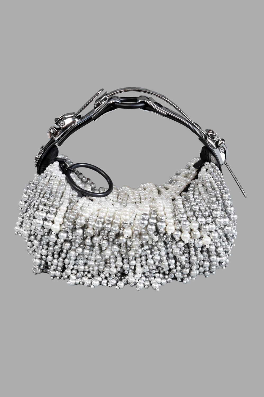 Full view of pearl-beaded half-moon shoulder bag with gradient silver beading, structured handle, and zip closure.