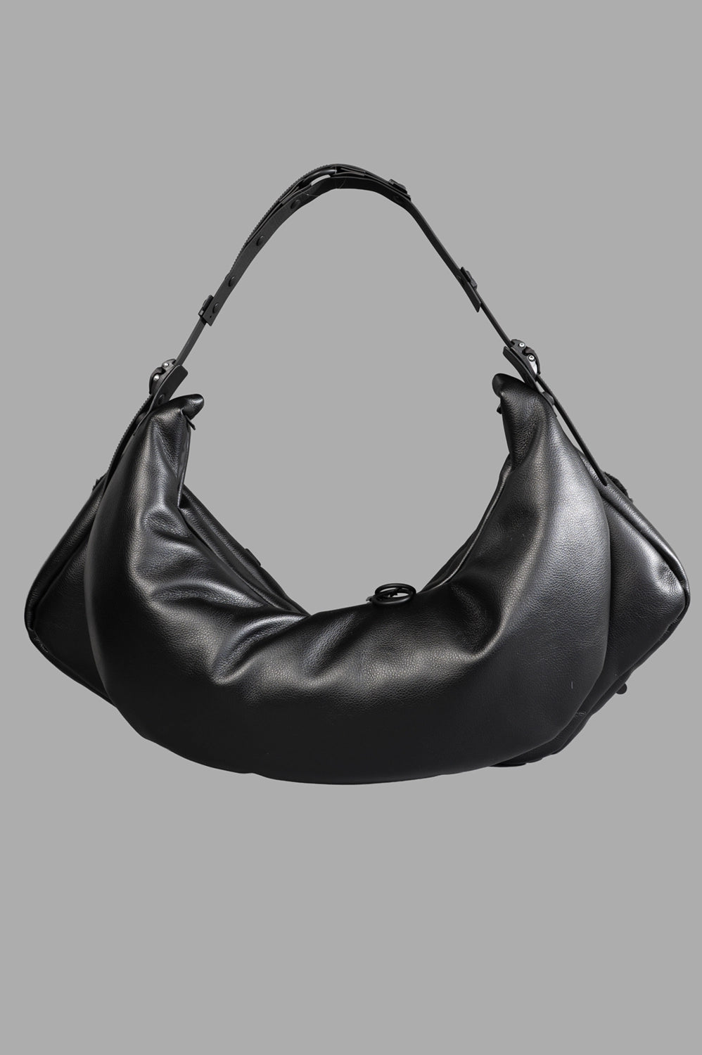 Back detail showing padded panel, adjustable handle components, and side strap hardware.