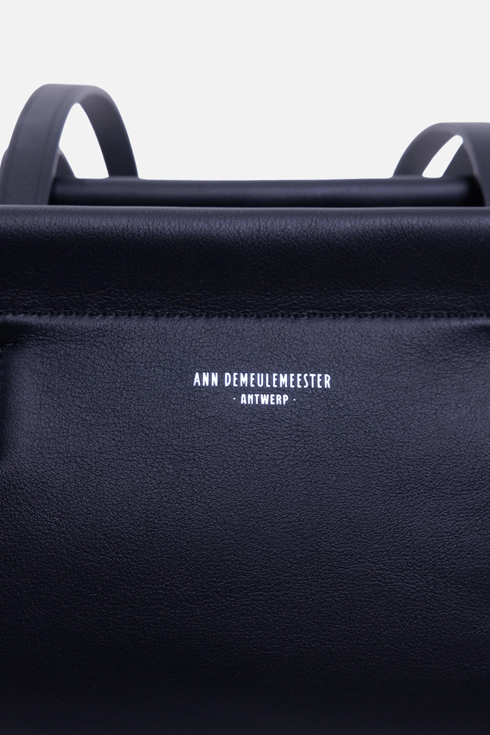 Ann Demeulemeester Harm shoulder bag in black, logo detail with silver Antwerp lettering on smooth leather