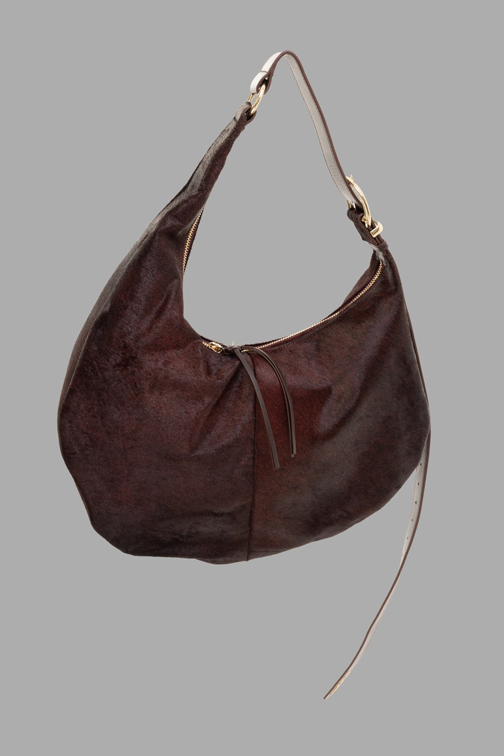 Des Phemmes women's hobo bag in Brun Brûlé, 3/4 view, haircalf texture with zip top and leather pull ties.