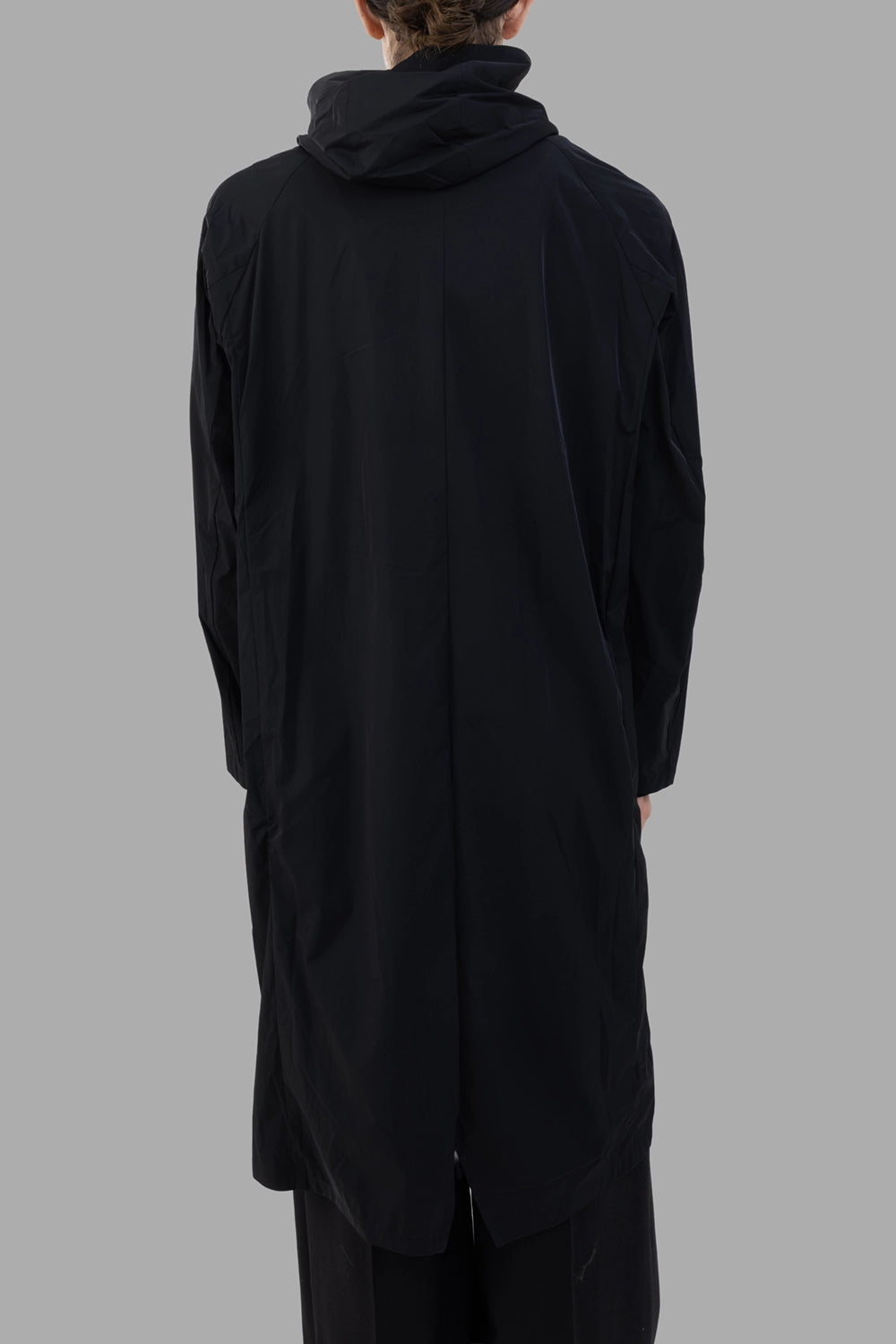 Attachment hooded coat in black, back view, center vent slit and relaxed hood