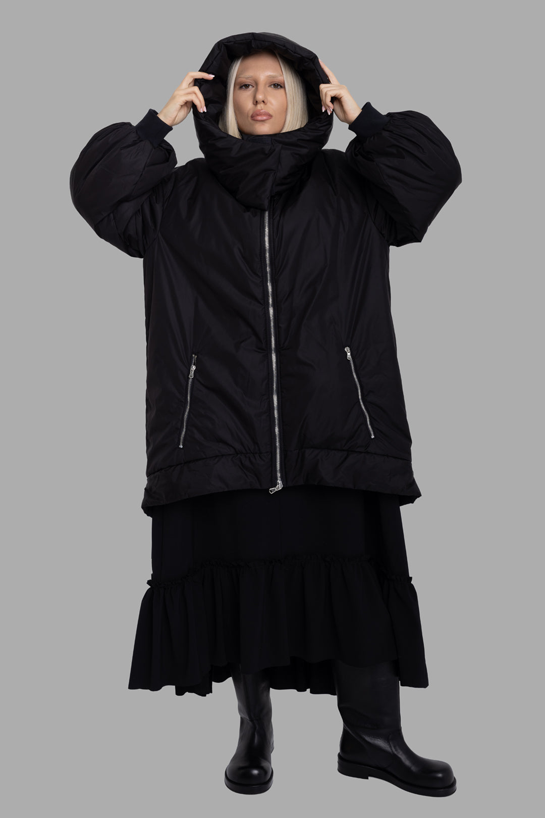 Sehnsucht Atelier women's black hooded puffer coat, on-model full length, oversized silhouette with extra tall funnel hood.