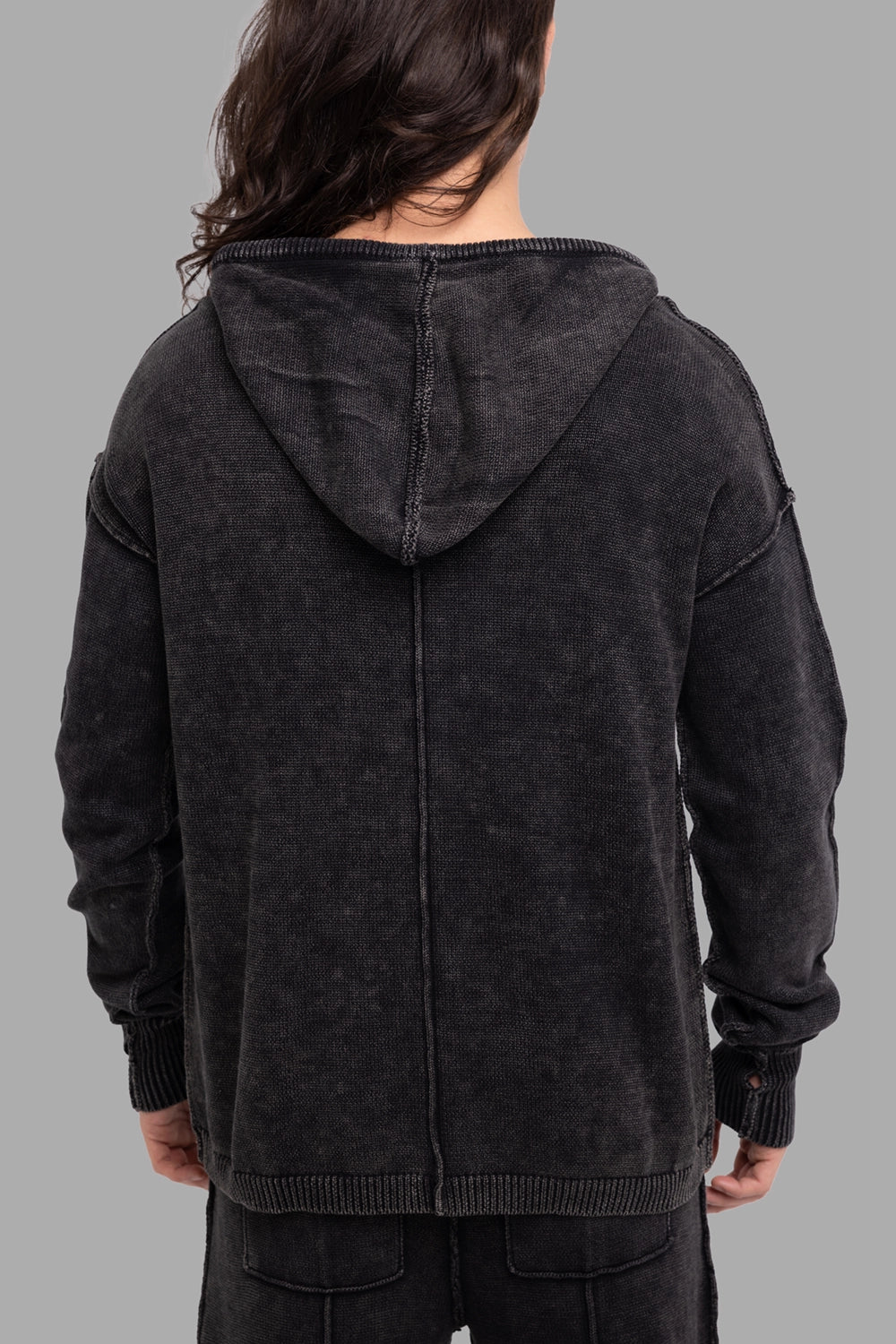 Justin Gall men’s knit hoodie in black, back view, three-panel hood and vertical back seam with washed texture