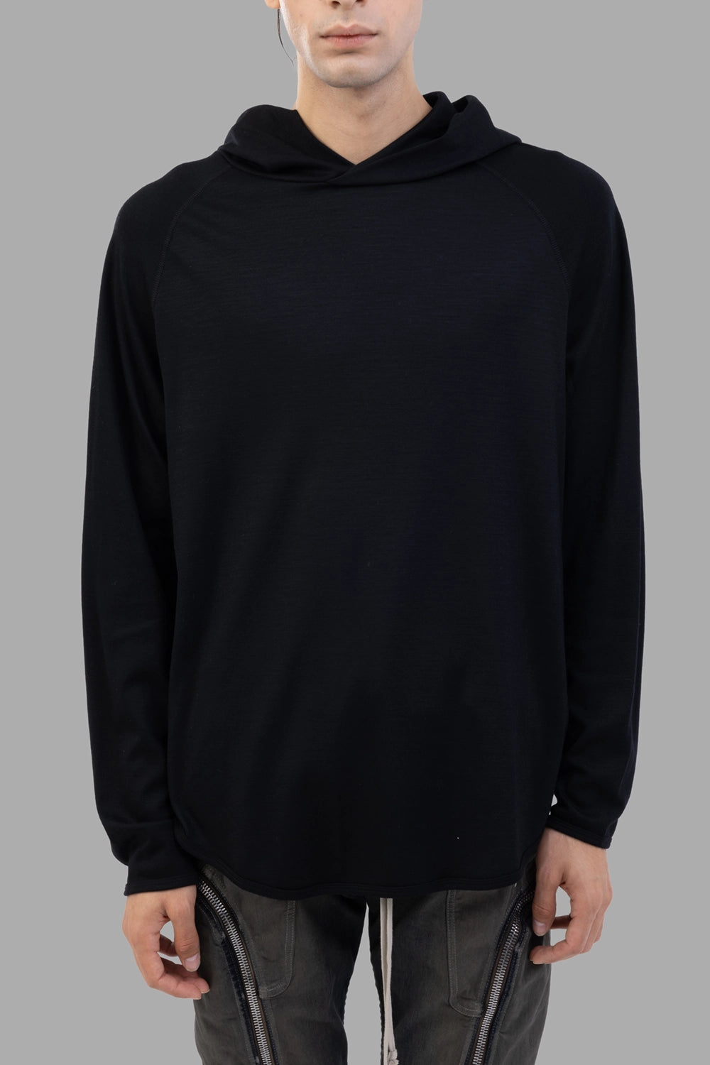 Attachment hoodie in black, front view, raglan sleeves and clean crew-style opening