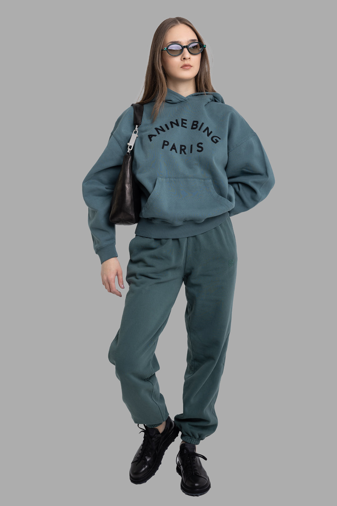 Anine Bing women’s dark teal Harvey Paris hoodie, on-model full length with oversized fit and kangaroo pocket
