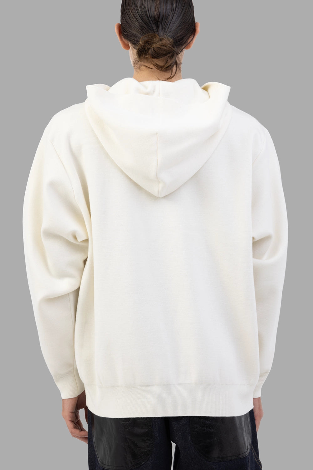 ATTACHMENT hoodie in off white, back view, clean panel and relaxed drop shoulders