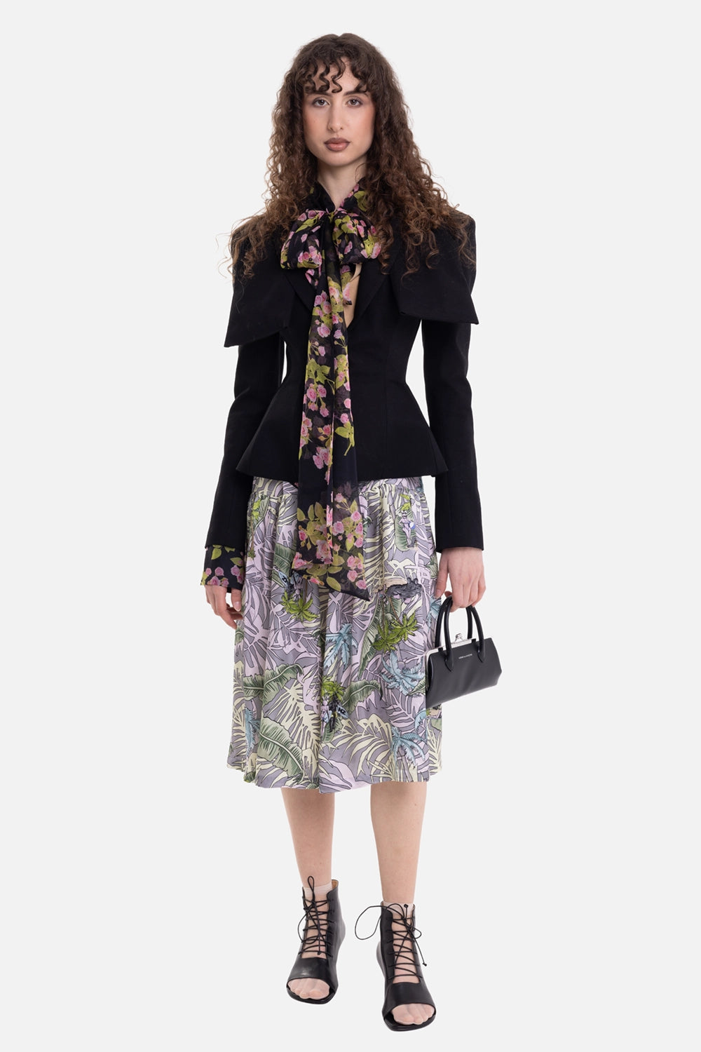 Torishéju women's jacket in black, on-model full-length view, peplum waist and oversized shoulder panels