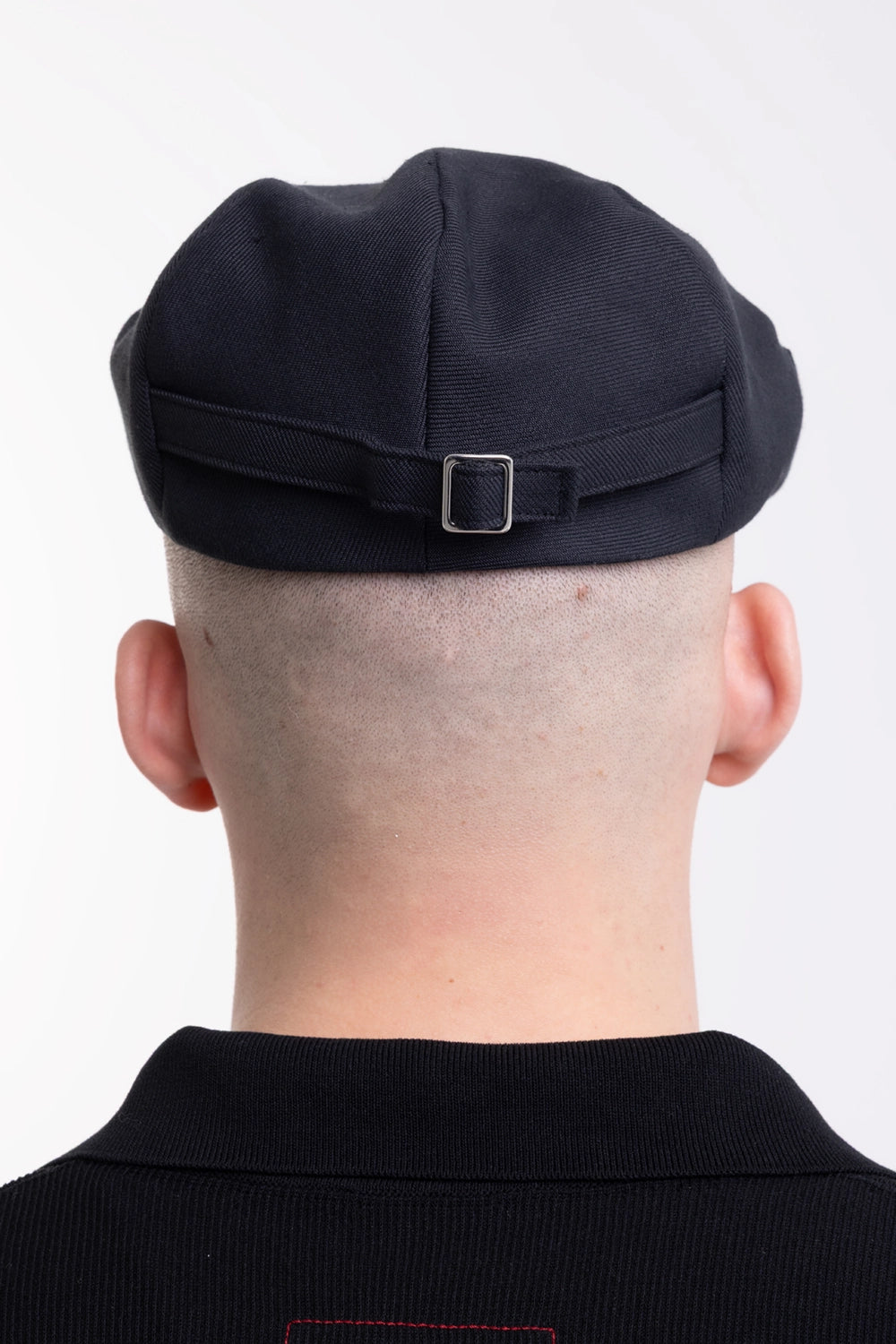 KIJIMA TAKAYUKI hunting cap in black, back view, adjustable self-fabric strap with silver-tone buckle