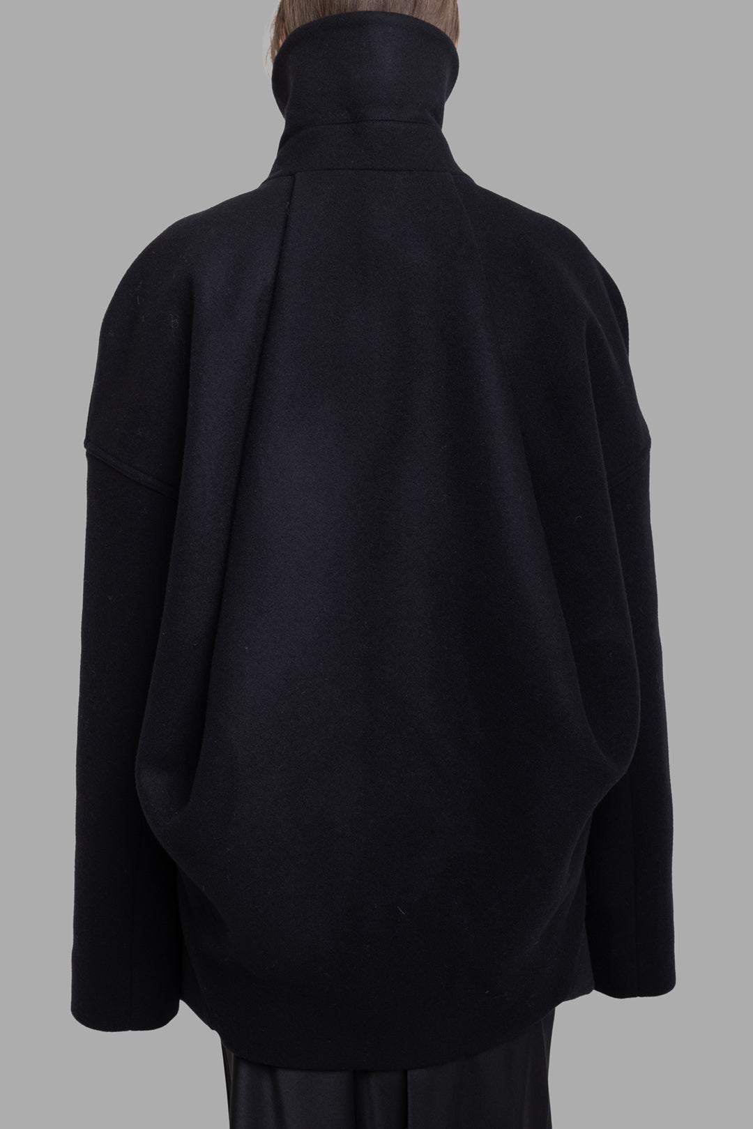Rick Owens women's black wool Draculimo jacket, back view, sculpted funnel collar and draped cocoon volume