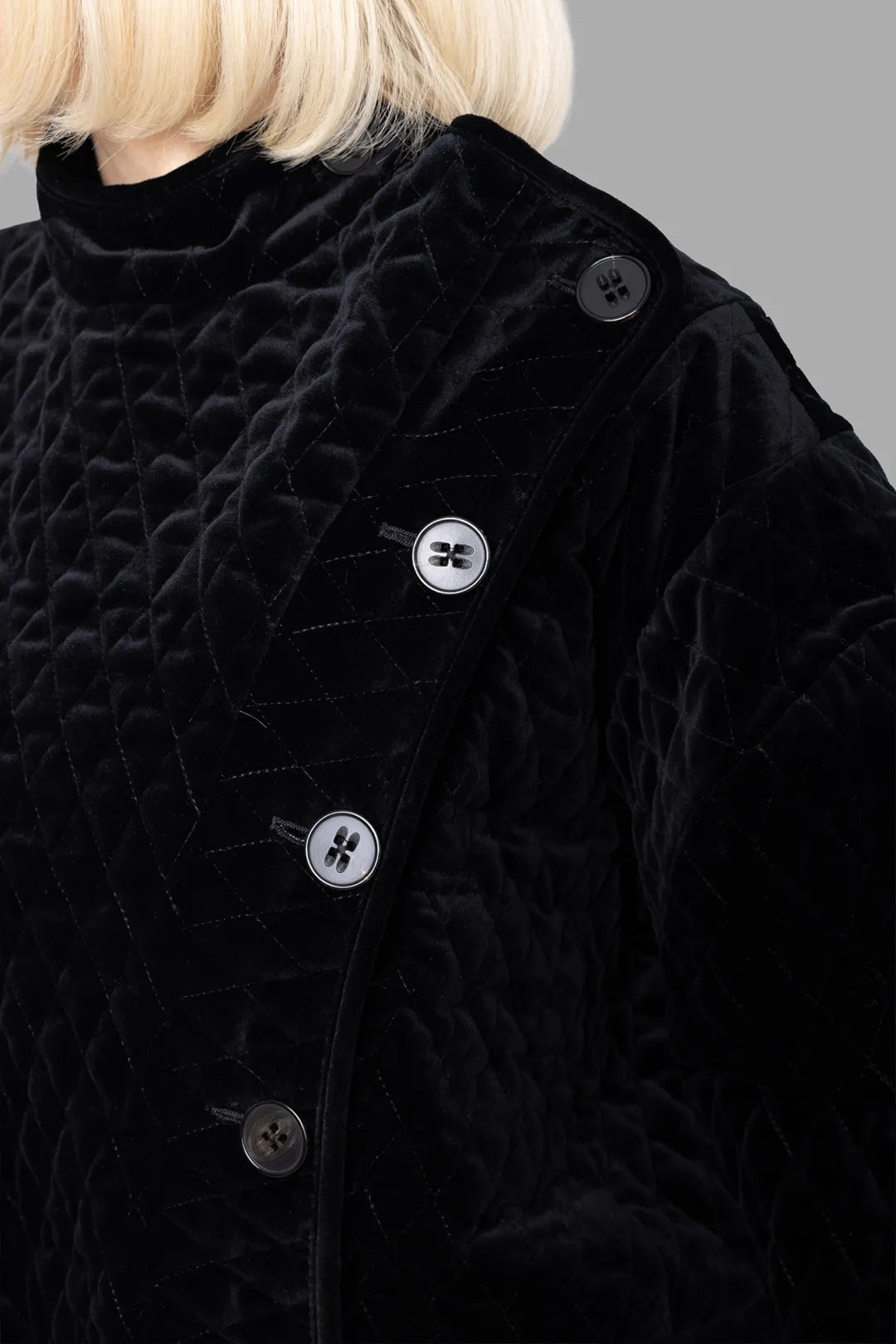 Vivienne Westwood women's black fencing jacket, button detail, close-up of quilted cotton velvet and curved placket.