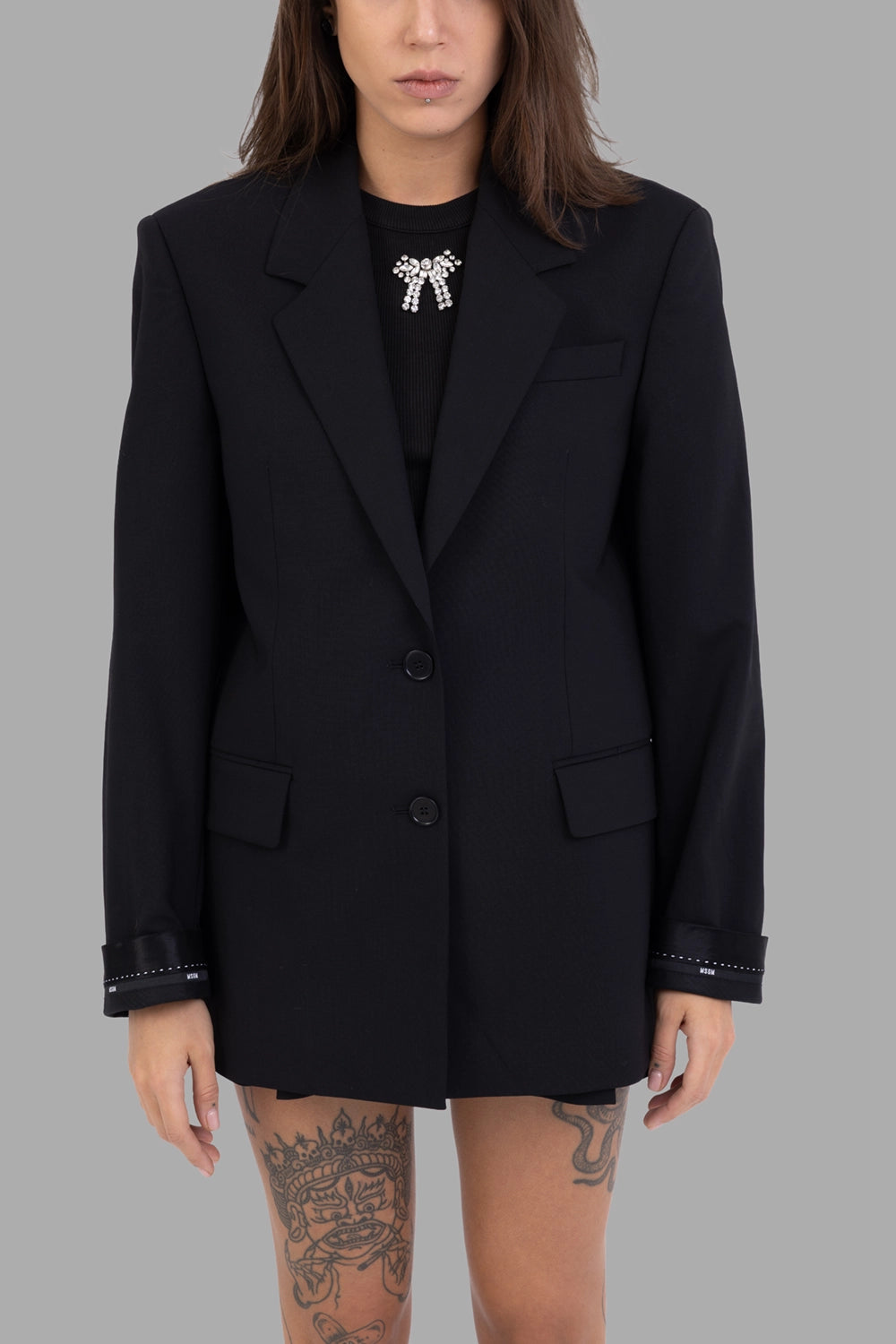 MSGM women's jacket in black, front view, two-button single-breasted with flap pockets and satin cuff ribbon