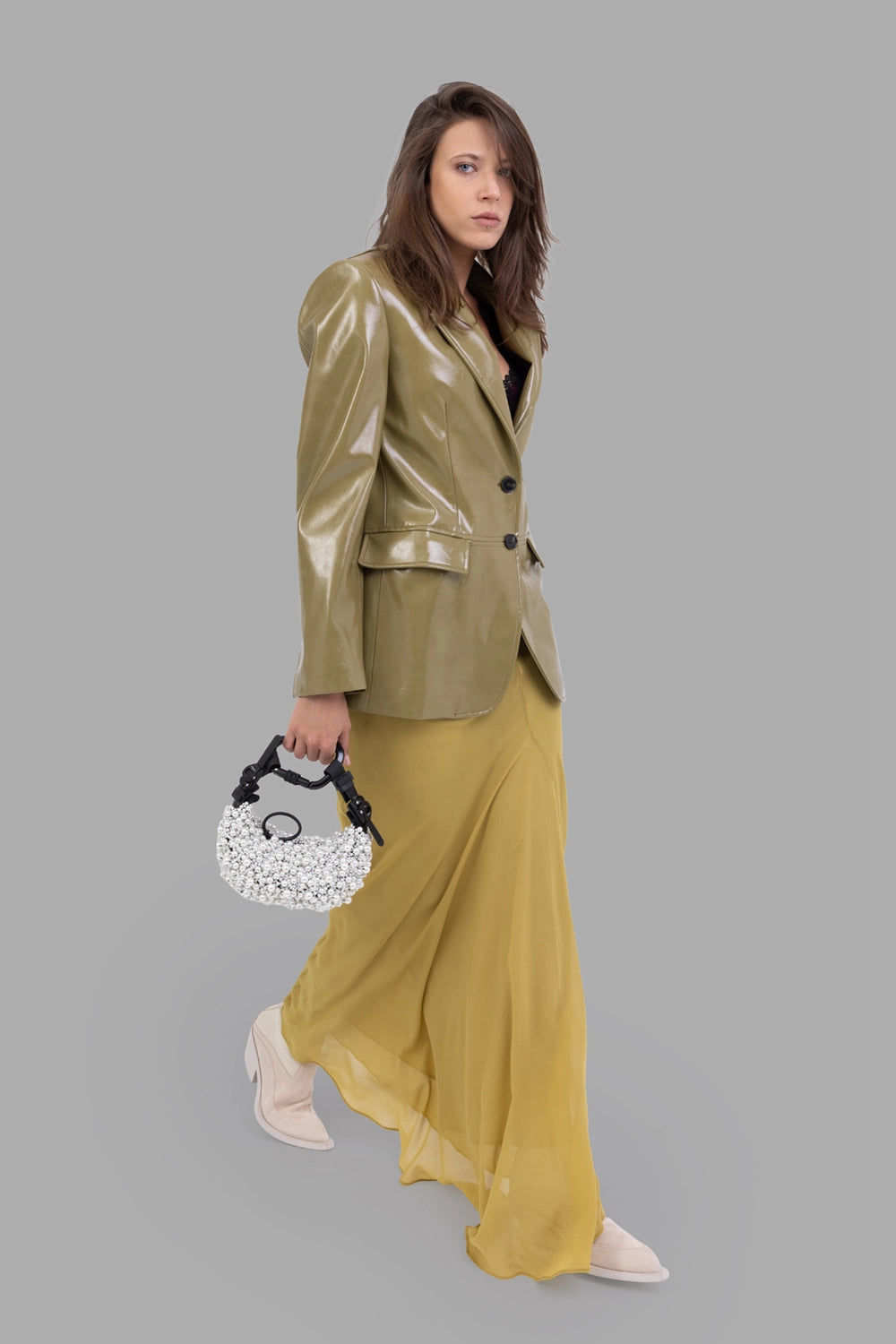 MSGM women's jacket in olive green, on-model full length side profile, glossy vinyl finish and notch lapels